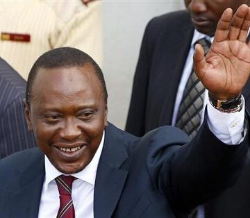 President-elect of Kenya Uhuru Kenyatta waves to his supporters in front of a church in his hometown Gatundu Kenyan leader, charged by ICC, invited to Somalia meeting in London