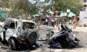 Destroyed vehicles at the scene of the car bombing in Mogadishu, Somalia