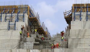 Construction workers are seen in a section of Ethiopia's Grand Renaissance Dam, as it undergoes construction, during a media tour along the river Nile in Benishangul Gumuz Region, Guba Woreda, in Ethiopia March 31, 2015. According to a government official, the dam has hit the 41 percent completion mark. Picture taken March 31, 2015. REUTER/Tiksa Negeri  - RTR4VQ4C