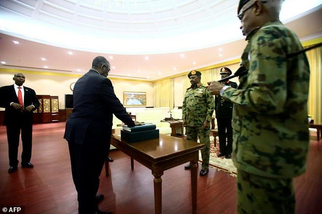 sudan New Sudan PM sworn in as protesters rally against emergency